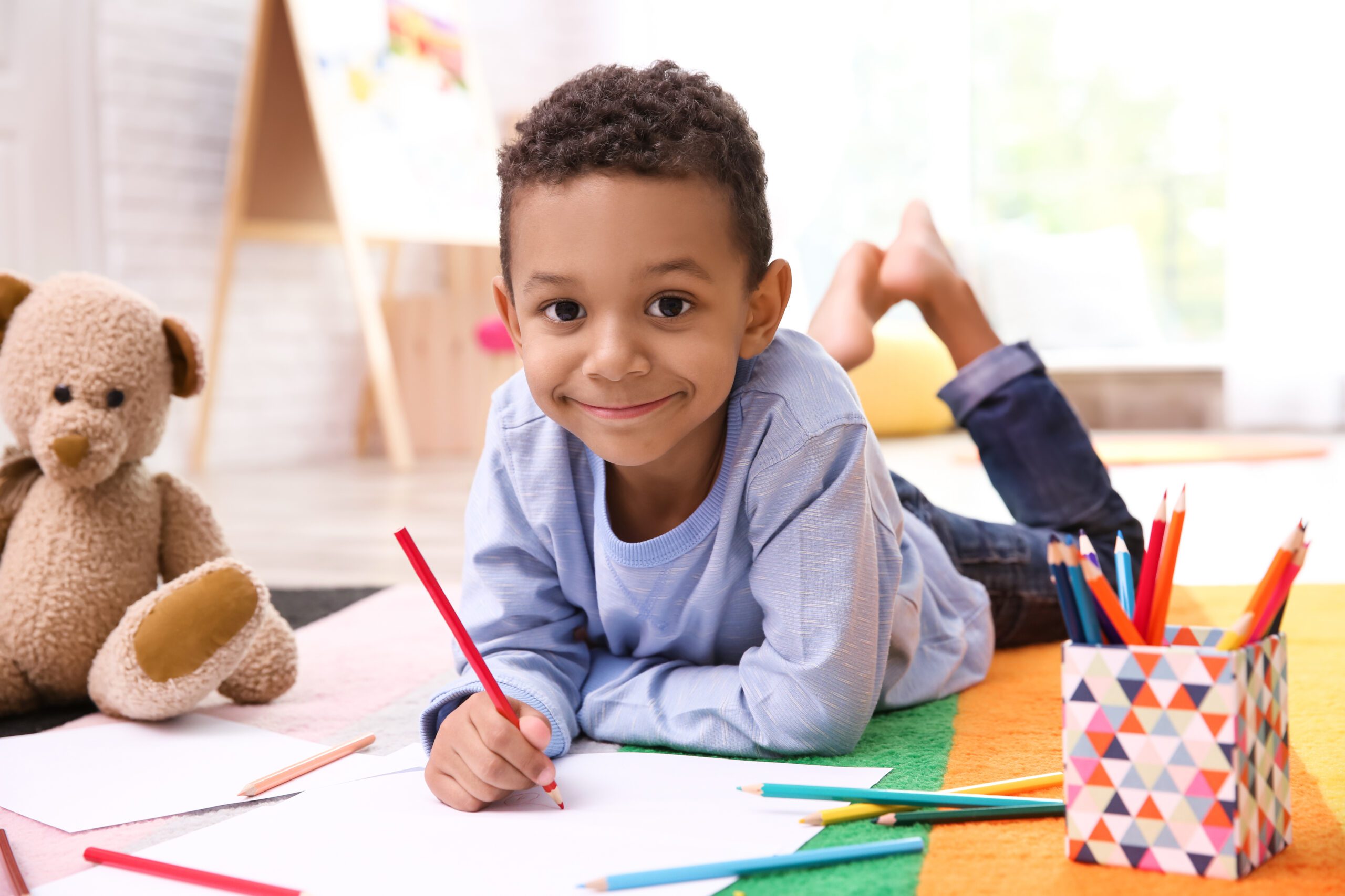 Group Of Elementary Age Children In Art Class With Teacher