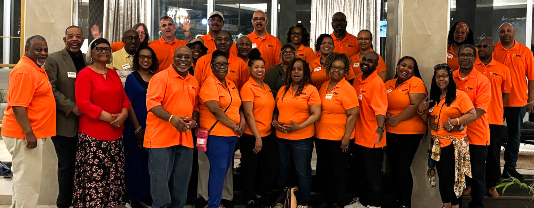 Top view of hand holding teal ribbon on dark background with copy space. Cervical and ovarian cancer, sexual assault, pcos, ptsd, anxiety disorder, agoraphobia and scleroderma awareness concept.