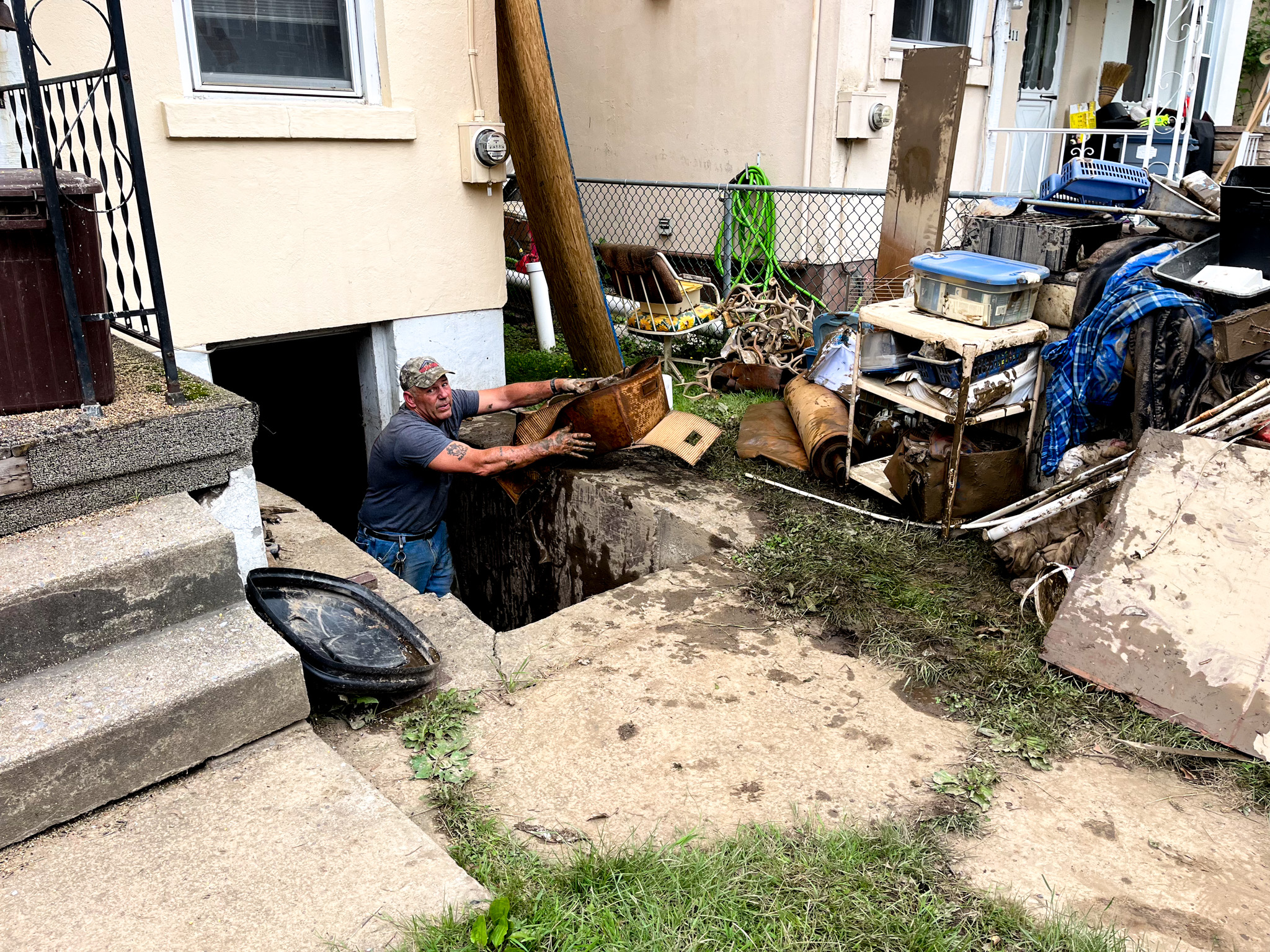 Top view of hand holding teal ribbon on dark background with copy space. Cervical and ovarian cancer, sexual assault, pcos, ptsd, anxiety disorder, agoraphobia and scleroderma awareness concept.