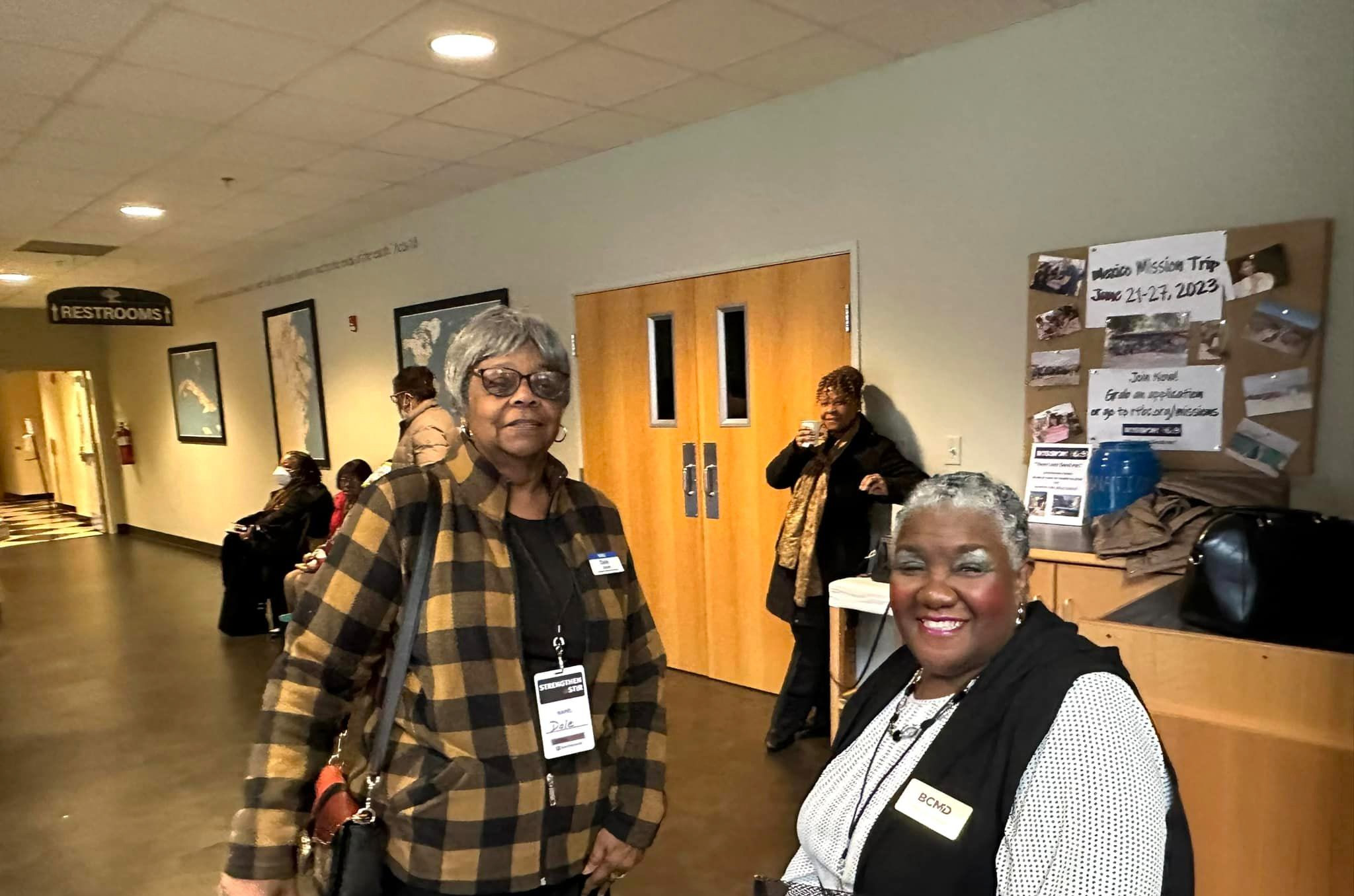 Top view of hand holding teal ribbon on dark background with copy space. Cervical and ovarian cancer, sexual assault, pcos, ptsd, anxiety disorder, agoraphobia and scleroderma awareness concept.