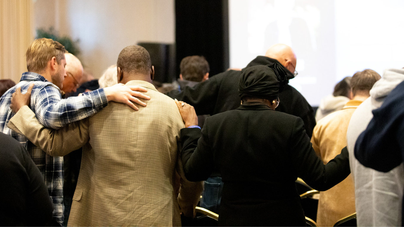 Top view of hand holding teal ribbon on dark background with copy space. Cervical and ovarian cancer, sexual assault, pcos, ptsd, anxiety disorder, agoraphobia and scleroderma awareness concept.