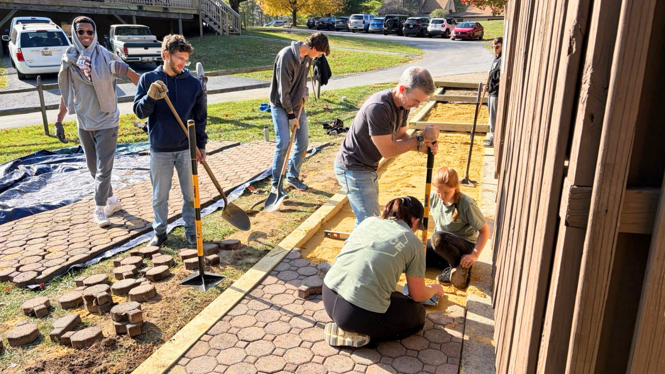 Top view of hand holding teal ribbon on dark background with copy space. Cervical and ovarian cancer, sexual assault, pcos, ptsd, anxiety disorder, agoraphobia and scleroderma awareness concept.