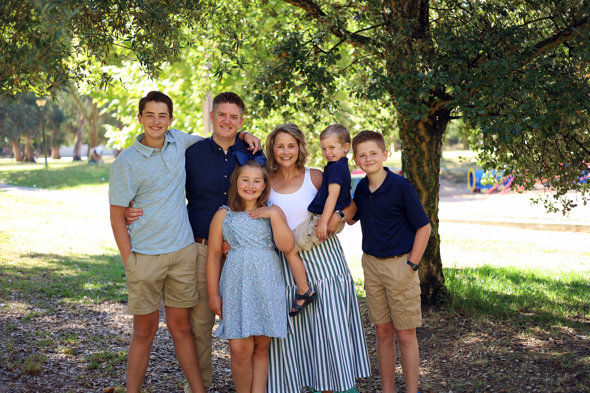 imb-photos-overcoming-cancer Top view of hand holding teal ribbon on dark background with copy space. Cervical and ovarian cancer, sexual assault, pcos, ptsd, anxiety disorder, agoraphobia and scleroderma awareness concept.