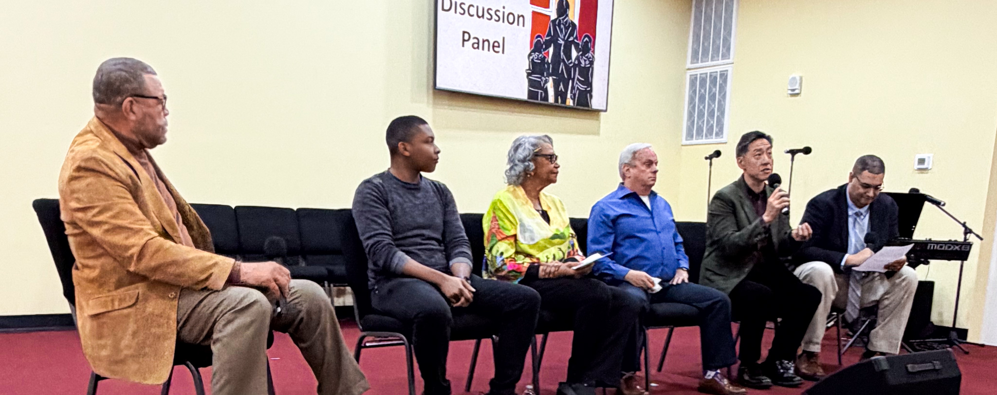 Top view of hand holding teal ribbon on dark background with copy space. Cervical and ovarian cancer, sexual assault, pcos, ptsd, anxiety disorder, agoraphobia and scleroderma awareness concept.