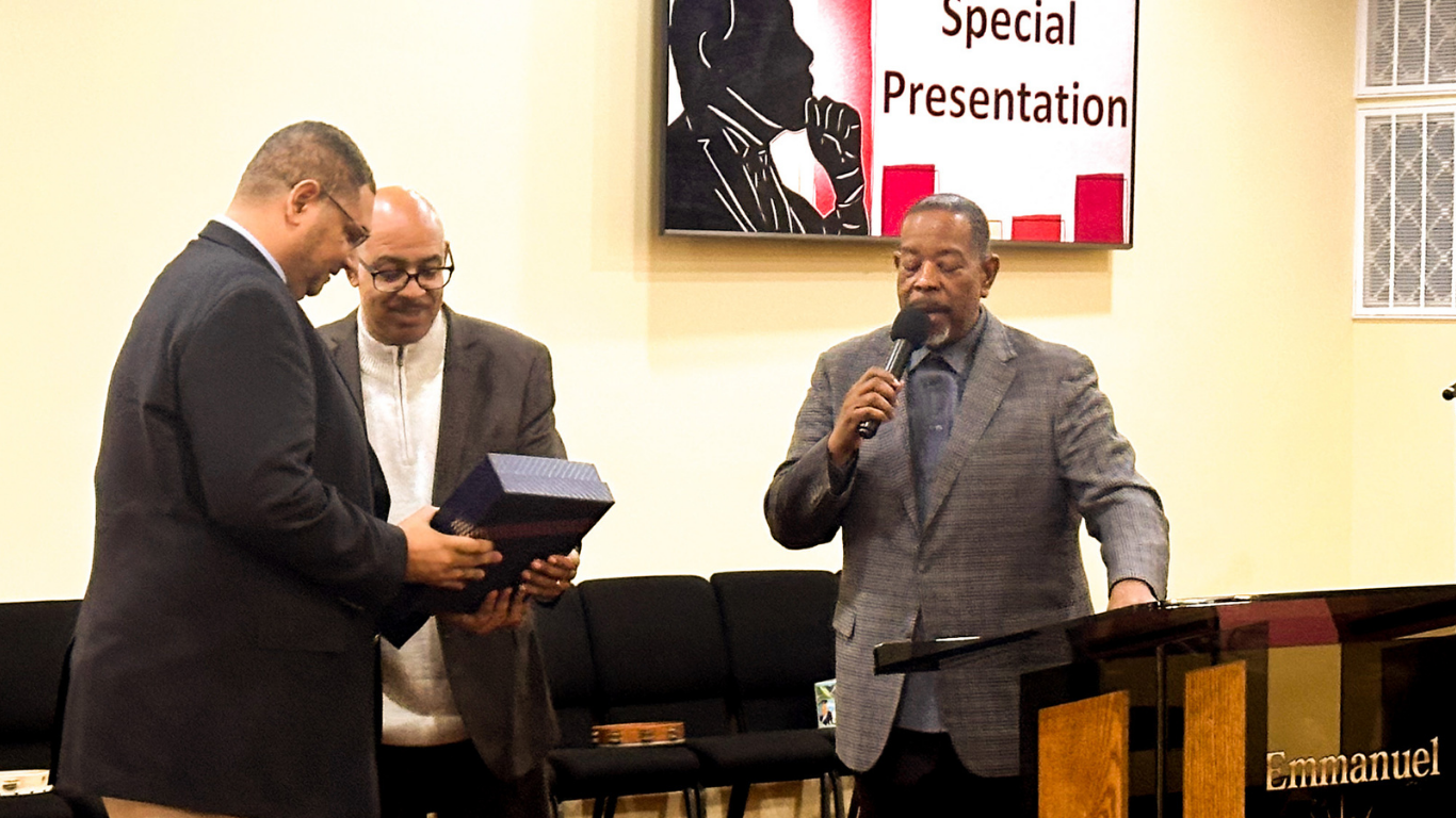 Top view of hand holding teal ribbon on dark background with copy space. Cervical and ovarian cancer, sexual assault, pcos, ptsd, anxiety disorder, agoraphobia and scleroderma awareness concept.