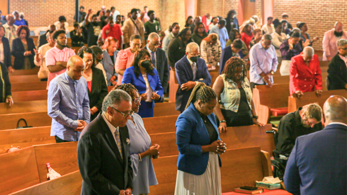 Top view of hand holding teal ribbon on dark background with copy space. Cervical and ovarian cancer, sexual assault, pcos, ptsd, anxiety disorder, agoraphobia and scleroderma awareness concept.