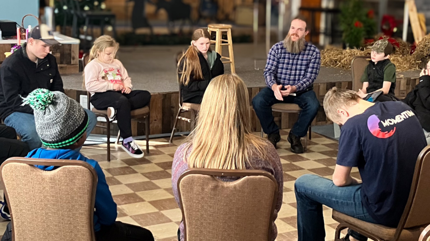 Size for blog (62) Top view of hand holding teal ribbon on dark background with copy space. Cervical and ovarian cancer, sexual assault, pcos, ptsd, anxiety disorder, agoraphobia and scleroderma awareness concept.