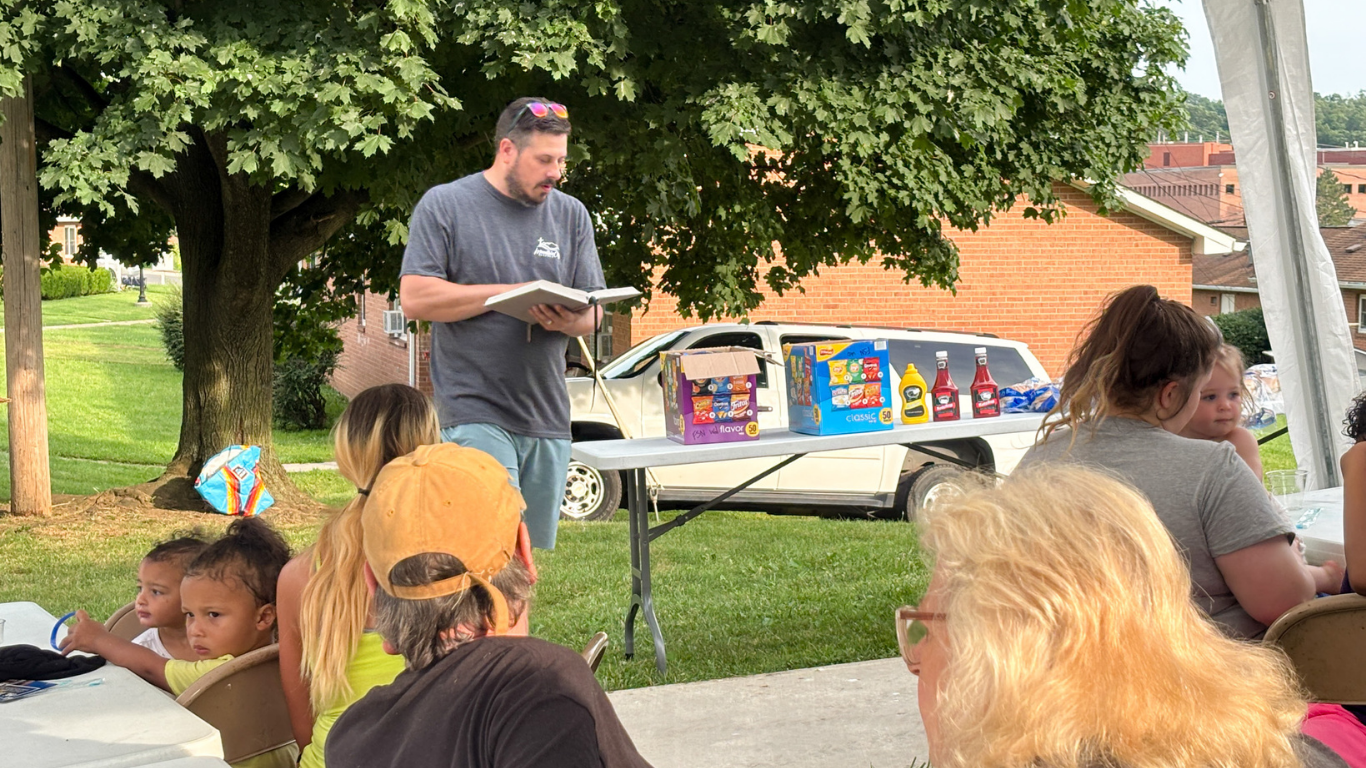 Size for blog (71) Top view of hand holding teal ribbon on dark background with copy space. Cervical and ovarian cancer, sexual assault, pcos, ptsd, anxiety disorder, agoraphobia and scleroderma awareness concept.