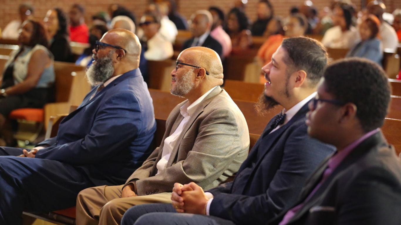 Top view of hand holding teal ribbon on dark background with copy space. Cervical and ovarian cancer, sexual assault, pcos, ptsd, anxiety disorder, agoraphobia and scleroderma awareness concept.